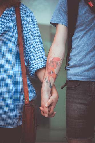holding hands man and woman holding hands woman